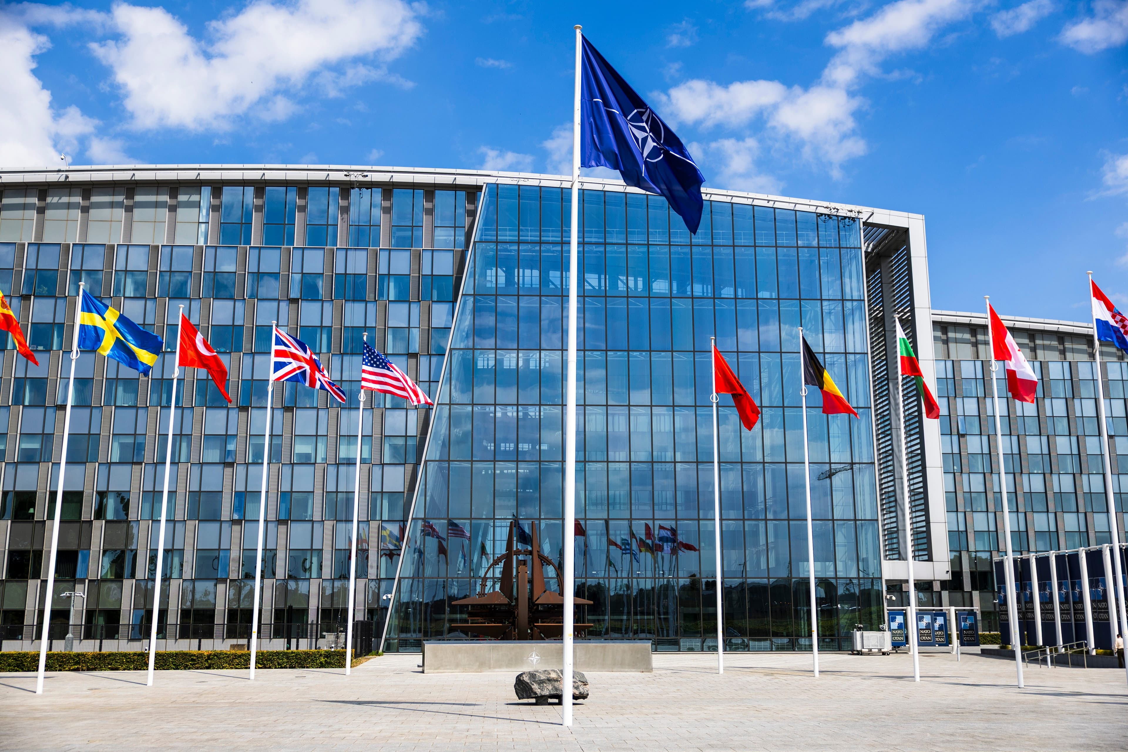 NATO Summit Tensions, Hormuz Uncertainty, and Container Rate Hikes